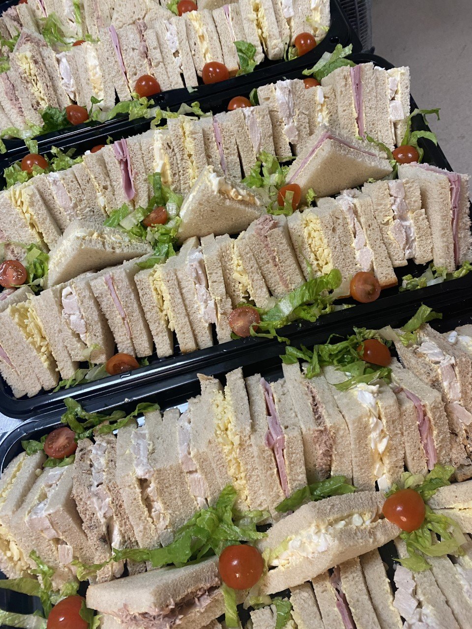 Professional corporate catering spread with stylish food presentation for a West London office event